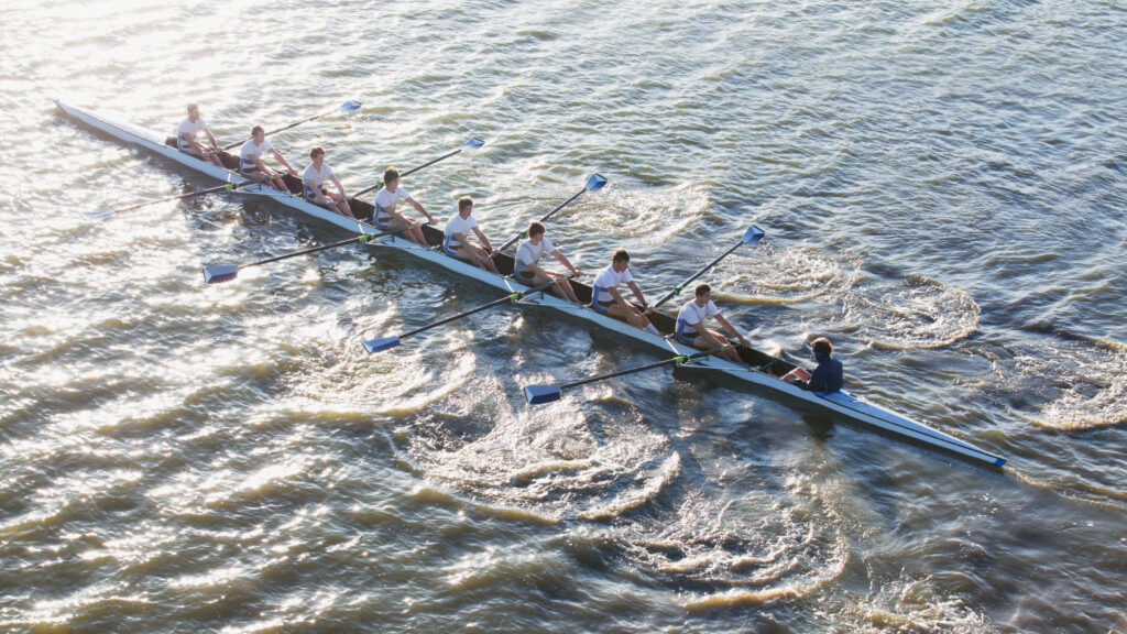 People in long canoe oaring