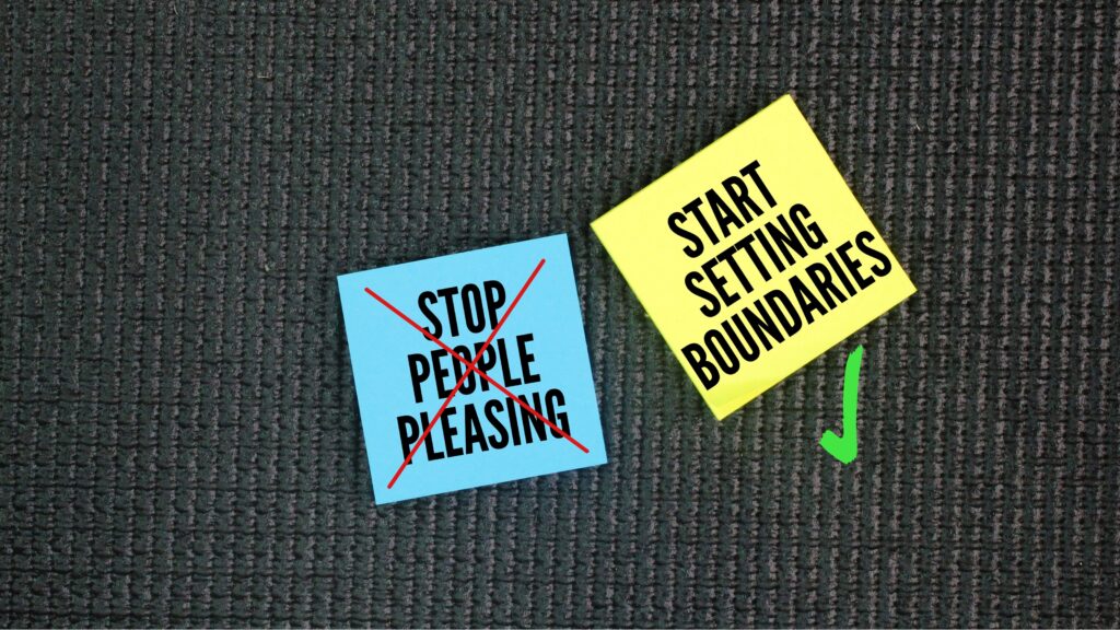 Sticky notes that say "stop people pleasing" and "start setting boundaries" on a textured black background.