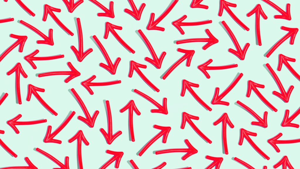 Multiple red arrows pointing every which way on a light green background.