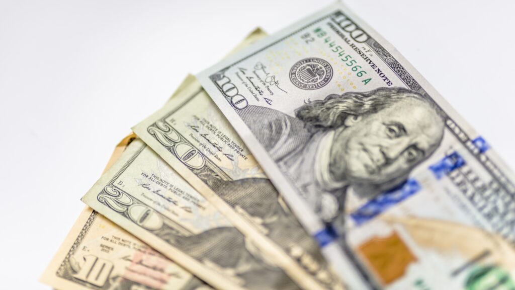Cash fanned out on a table.