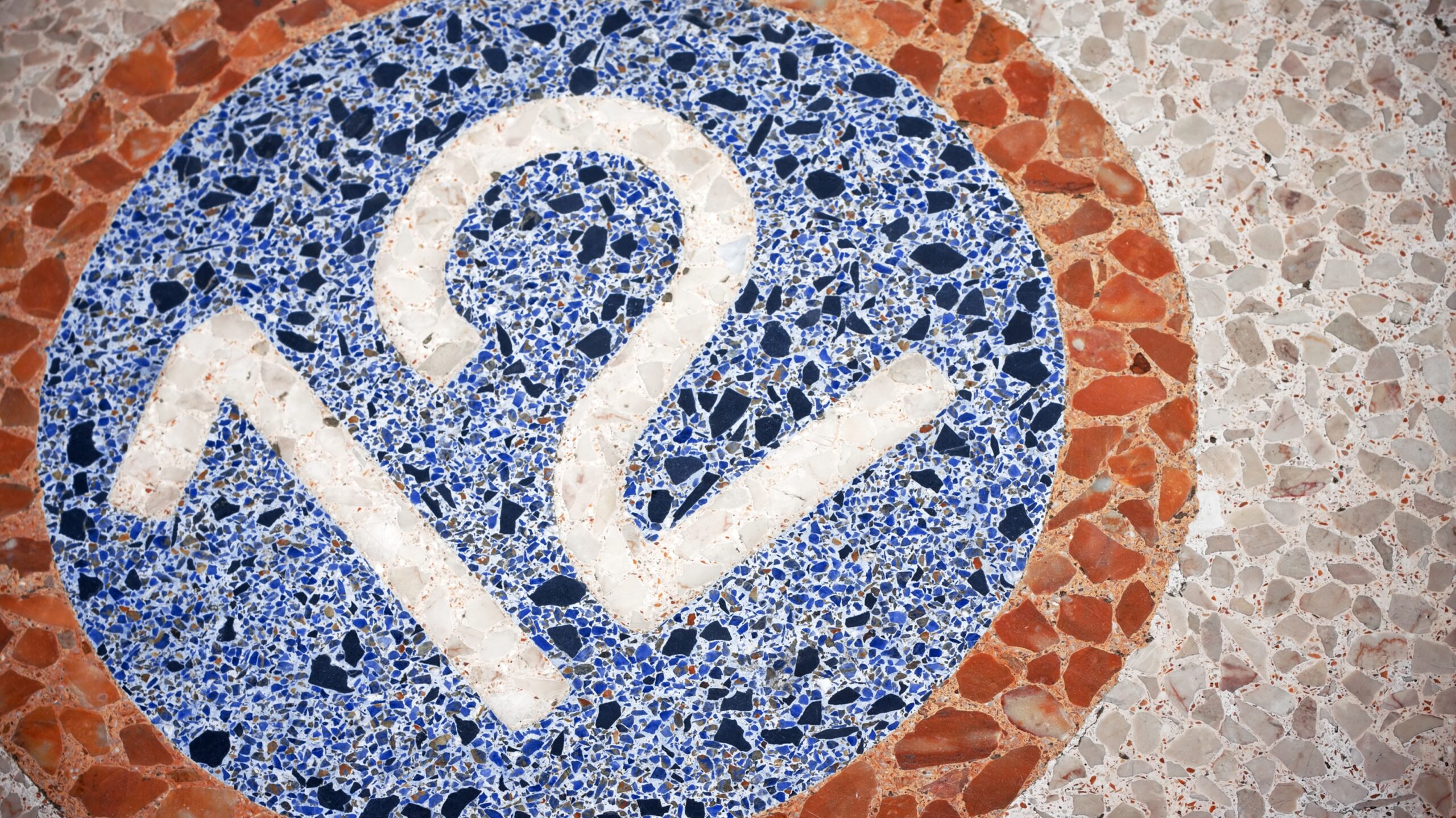 The number 12 displayed on a mosaic floor.
