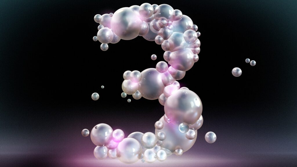 The number three composed of bubbles against a black background.