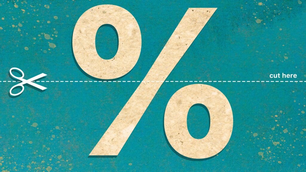 Scissors cutting through a percentage sign against a green background.