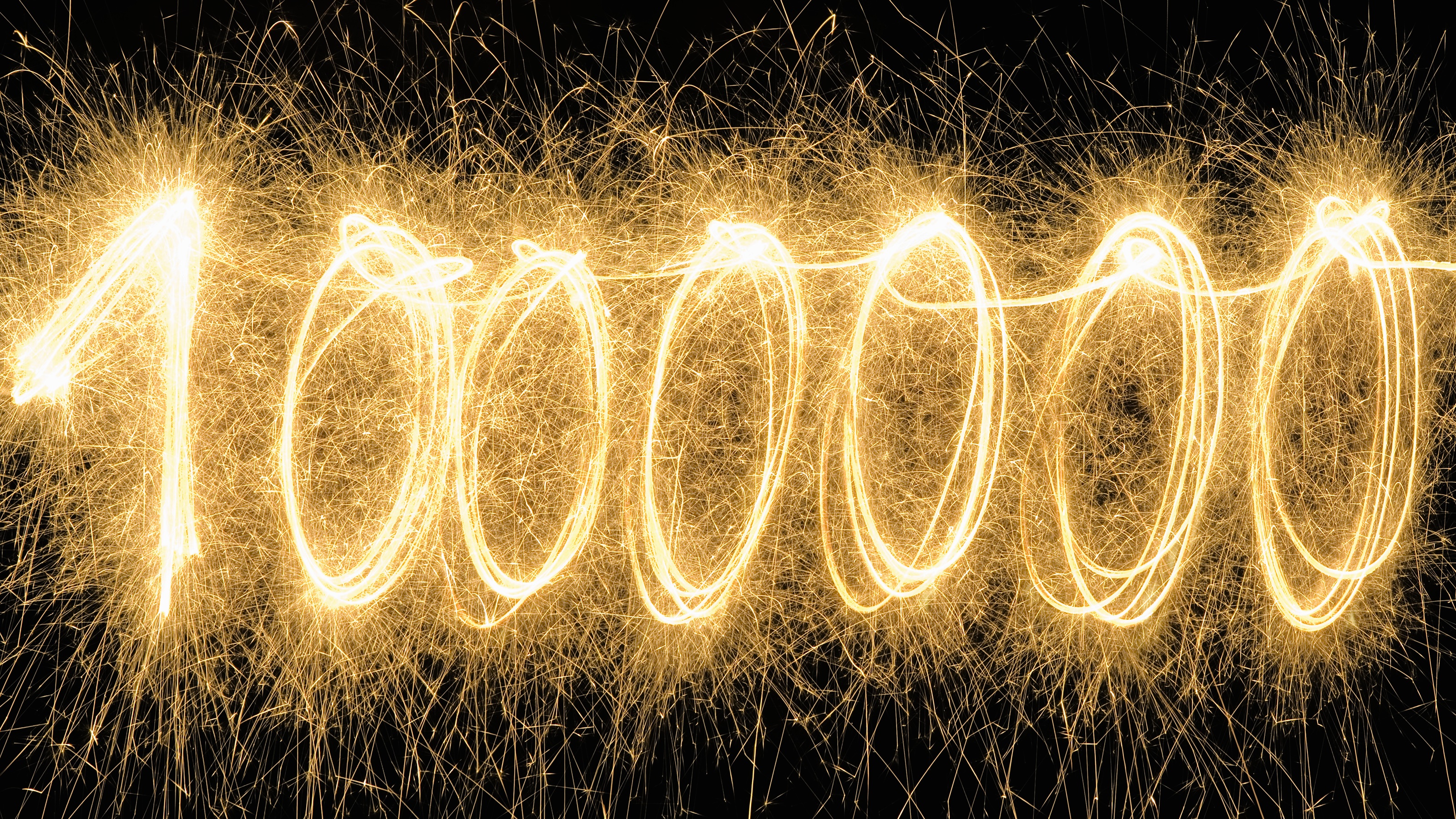 Le chiffre un million épelé avec des cierges dorés.