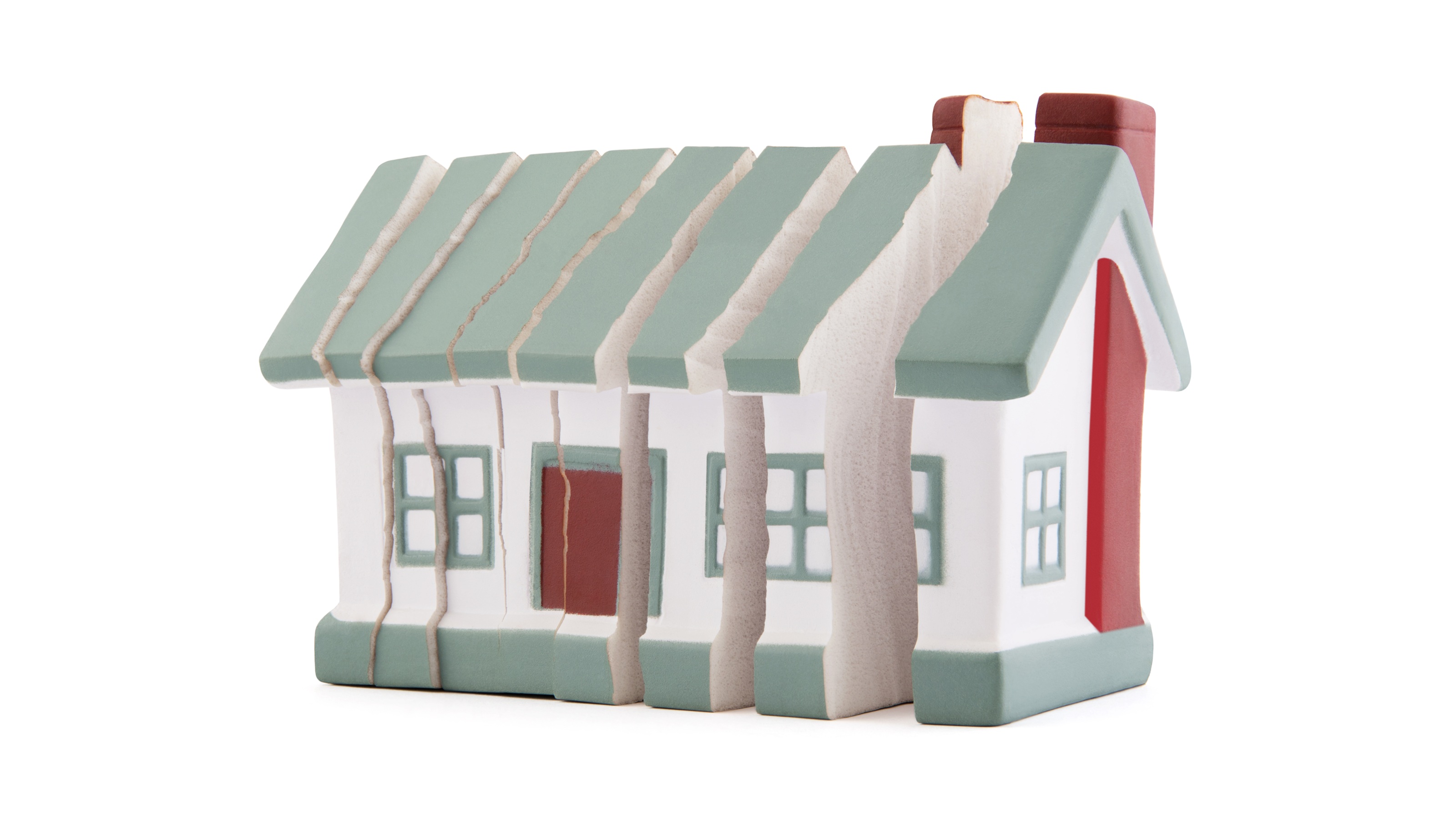 Une maison jouet est découpée en plusieurs segments verticaux.