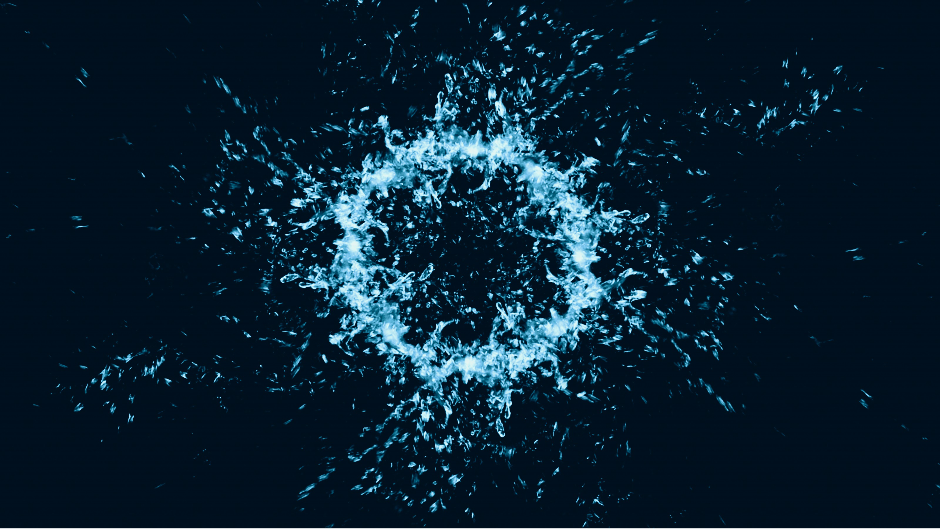 Une bulle bleue éclate sur fond noir.