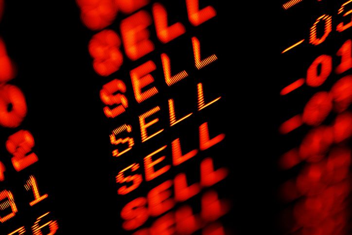 tickerboard covered in red SELL words and negative prices