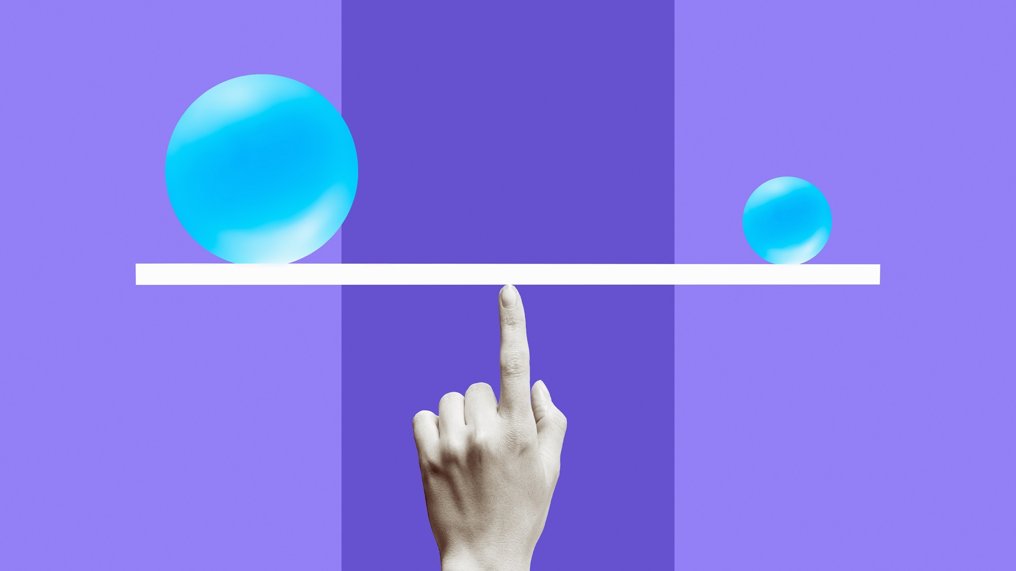 Une boule bleue et une boule bleue plus petite en équilibre sur une ligne blanche avec un doigt semblant la maintenir.