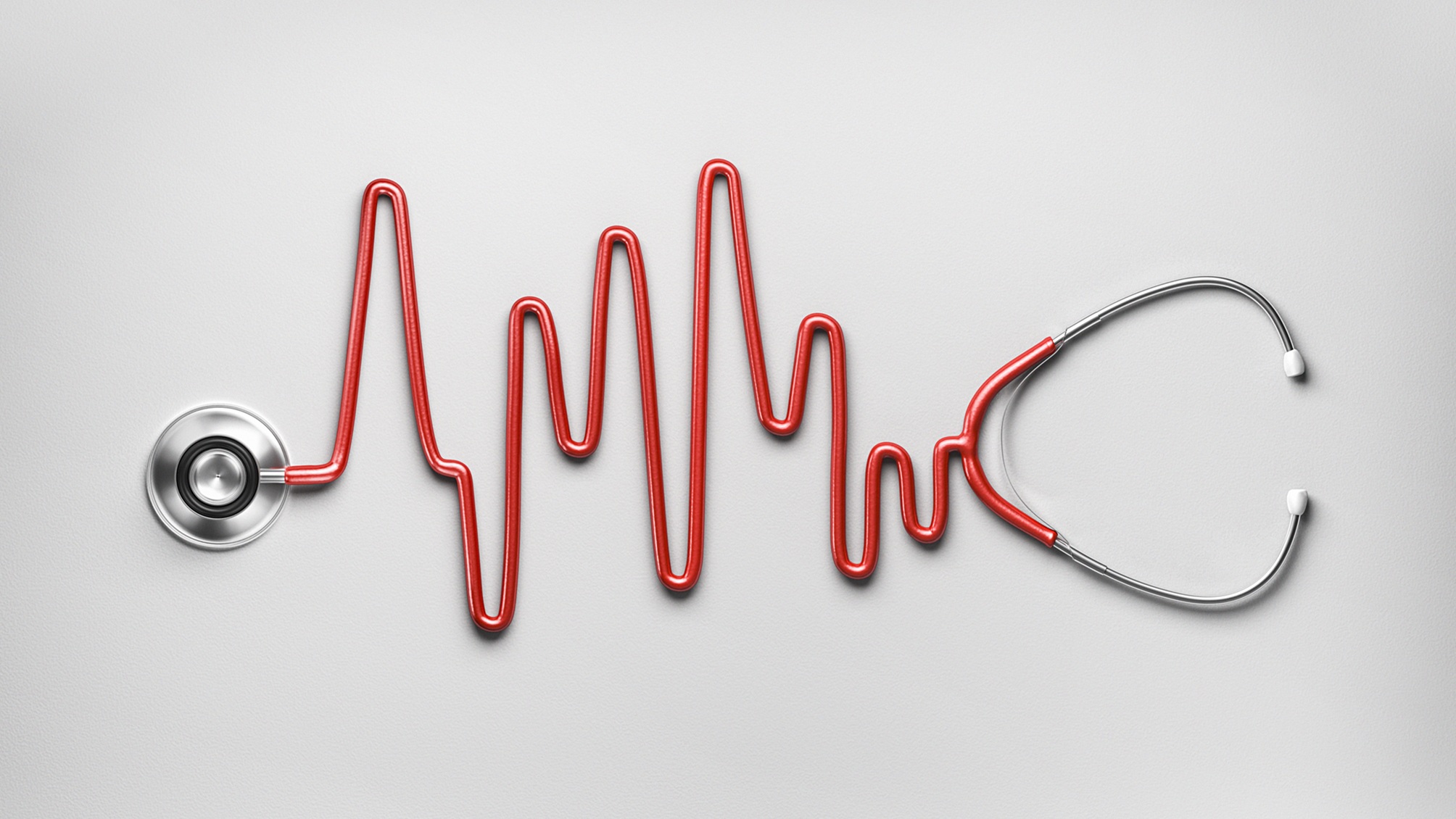 Un stéthoscope avec le câble rouge formant une forme de moniteur cardiaque.