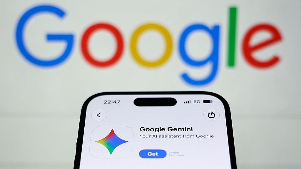 The Google Gemini app download page on a smartphone with the Google logo blurred in the background